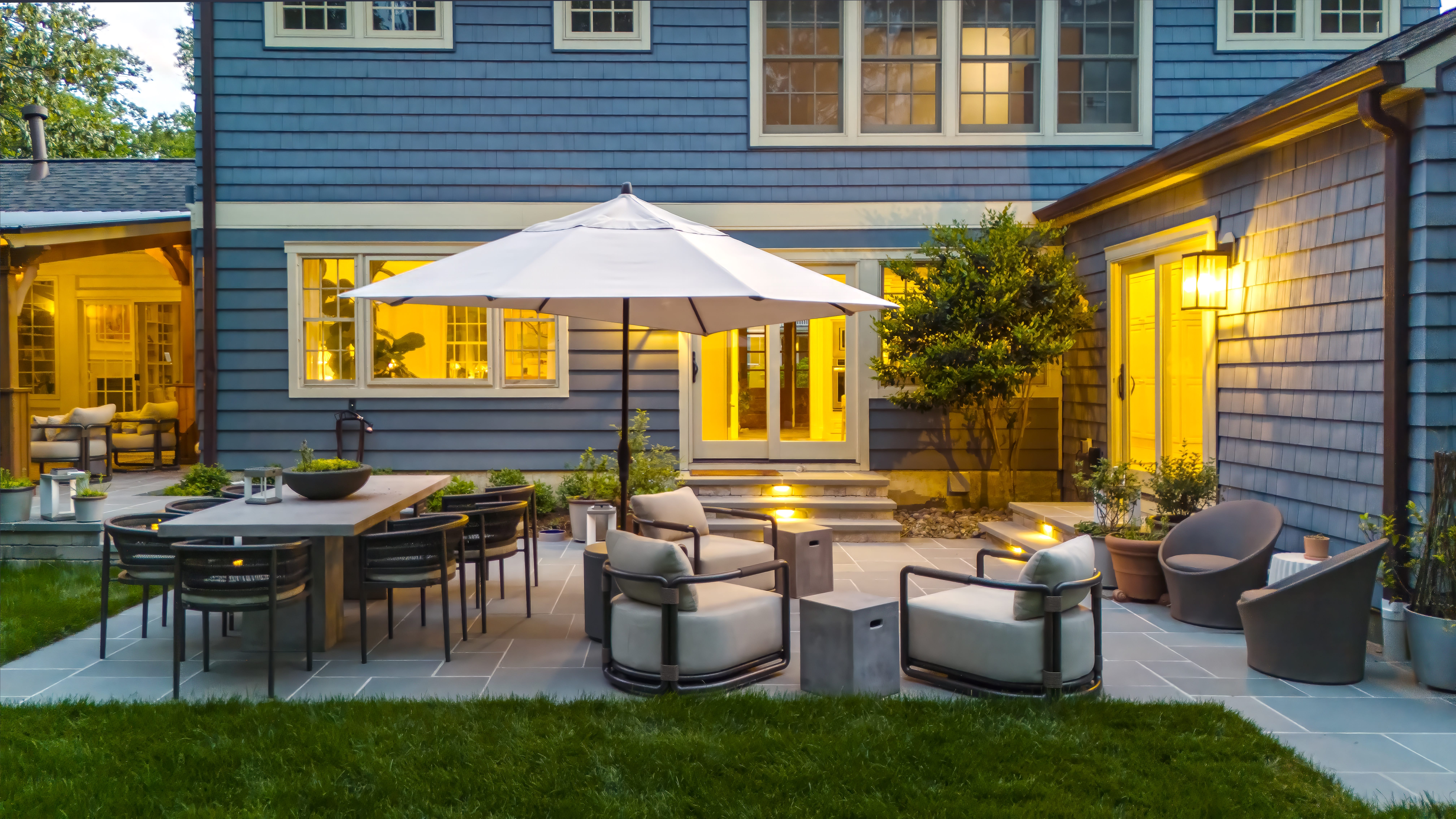 Multi-tone stone patio featuring custom patterns designed for outdoor entertaining.