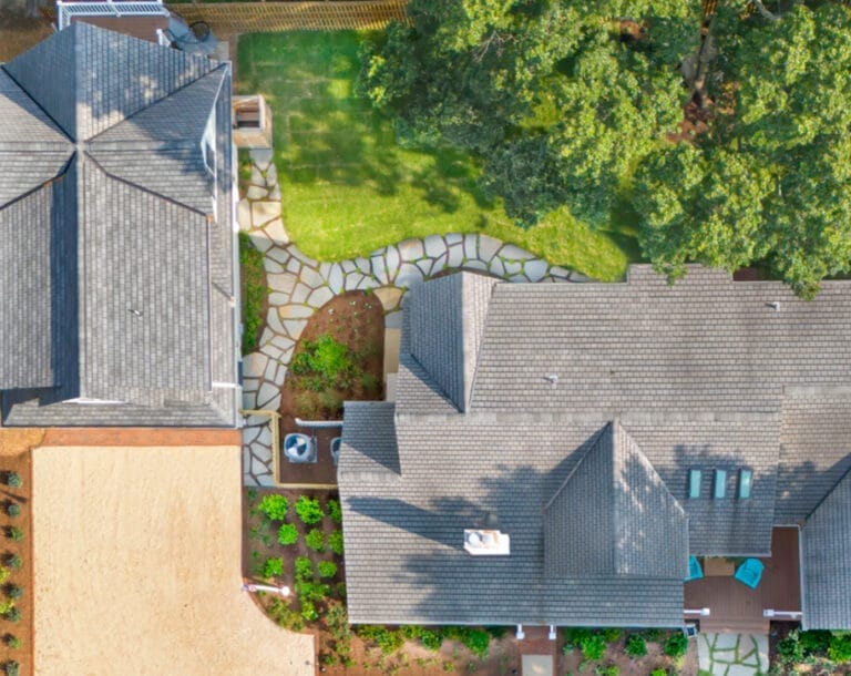 Aerial view of custom stone walkway in Ridge-designed backyard.