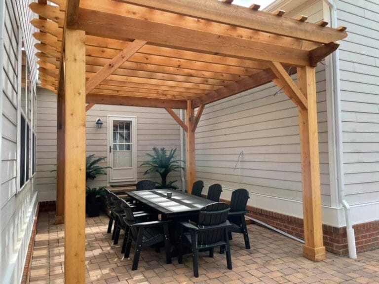 Custom wooden pergola with shade cover installed in Maryland backyard by Ridge