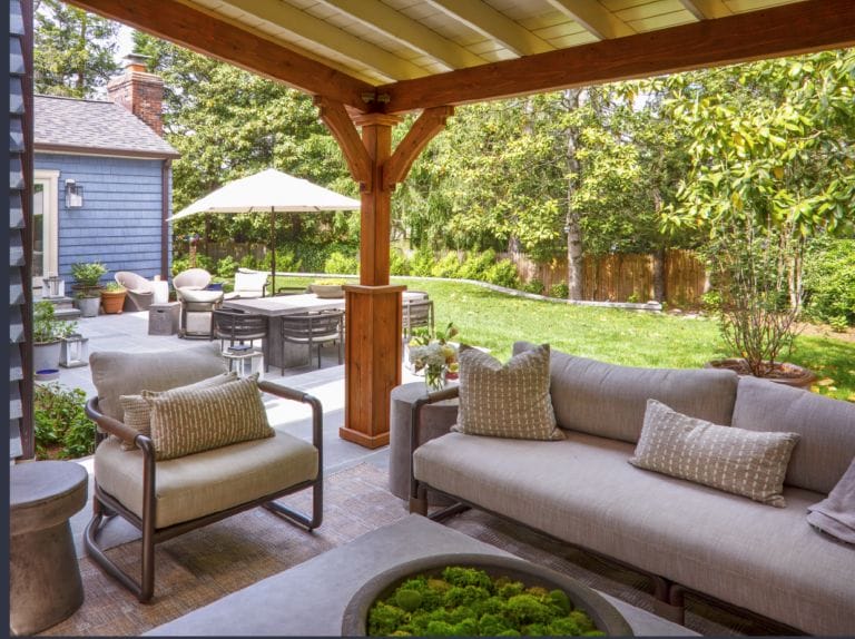 White pergola with outdoor kitchen, stone bar seating, composite deck, and hot tub - Ridge